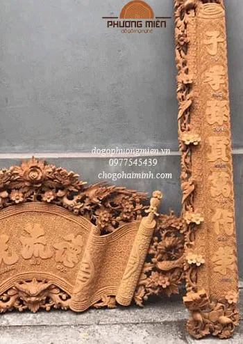 Cuốn thư câu đối mai hoá long gỗ gụ.